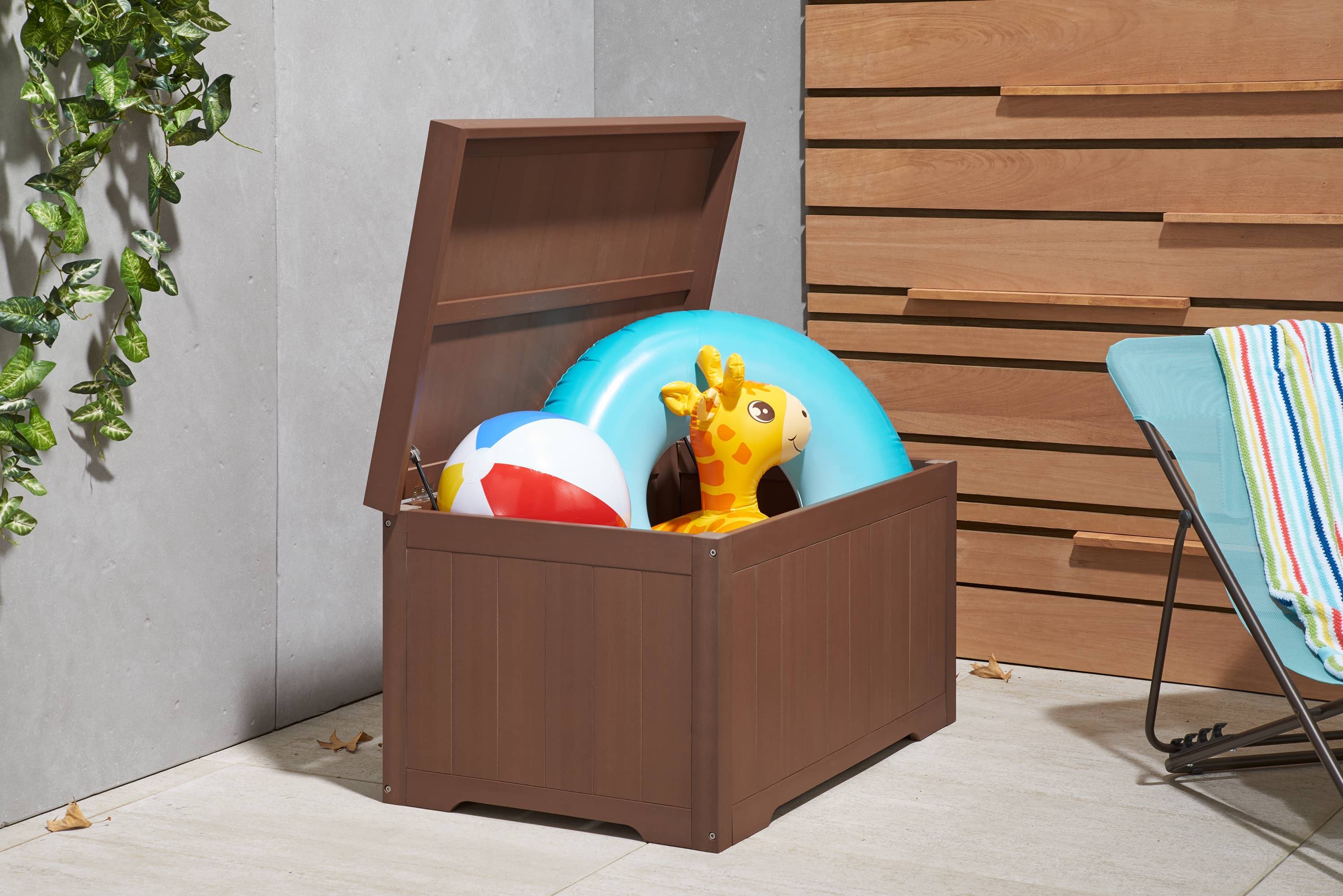outdoor patio storage box filled with swimming pool items