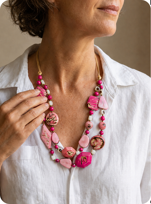 Woman wearing a vibrant Tagua necklace