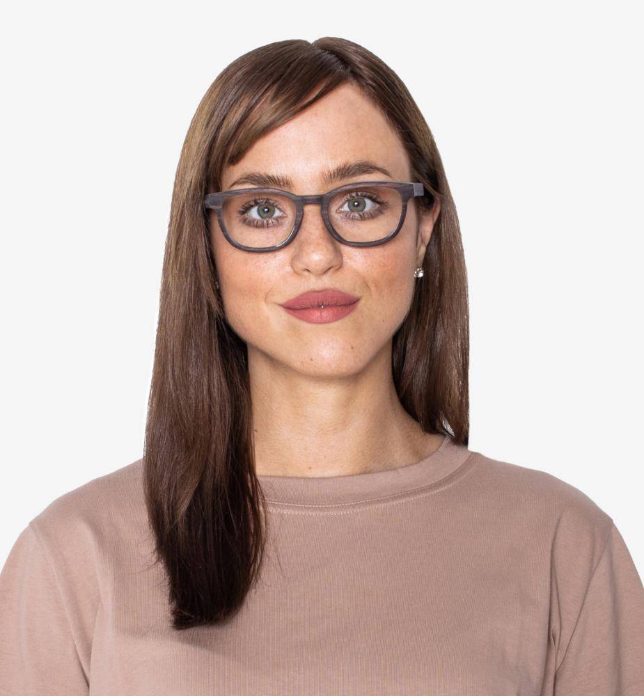 Woman with oval face shape wearing Bliss Purple, Small Rectangle Eyeglasses made from Sandal Wood with a light brown shirt