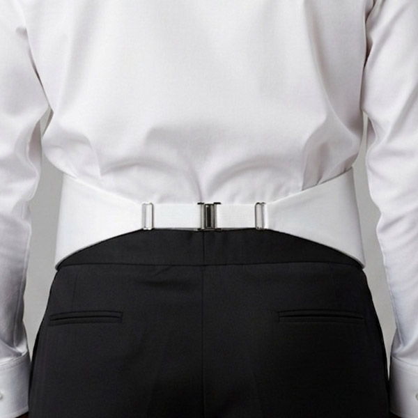 Back view of a man wearing on a white cummerbund over a white dress shirt and black dress pants, showing how a cummerbund secures in the back.