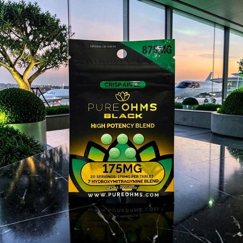 Package of Pure Ohms Black with 175mg high potency blend, modern setting.