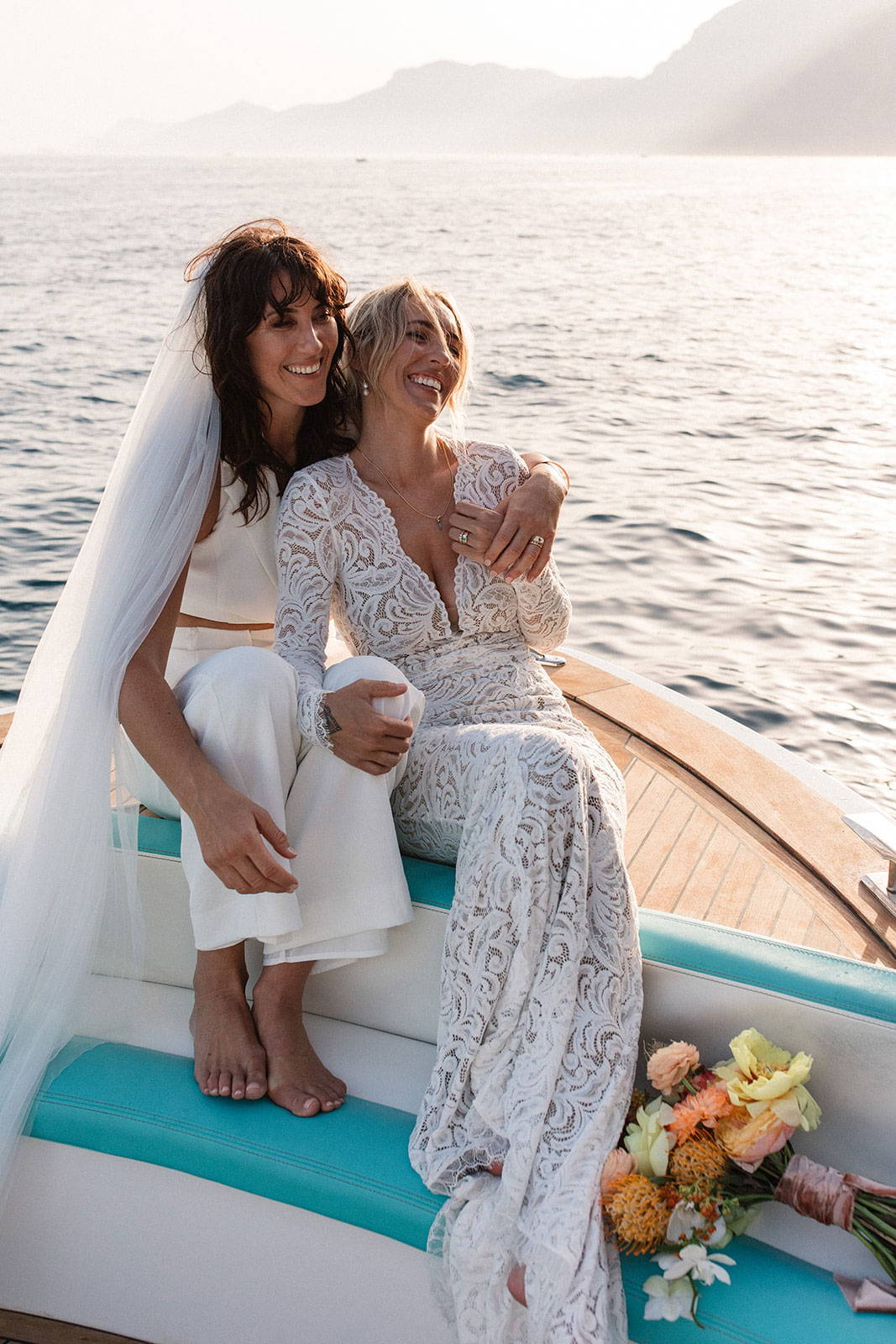 Brides on a boat in Positano, Italy