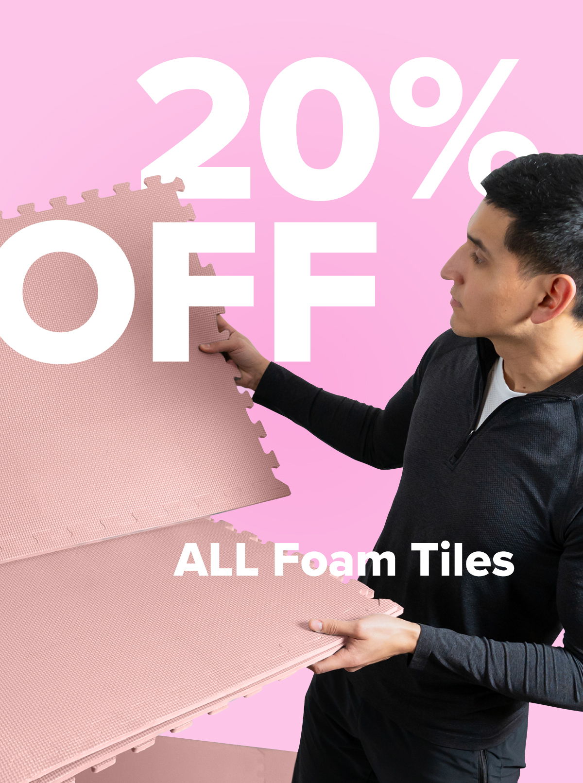 Man holding foam tiles with 