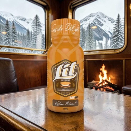 Bottle of Lit beverage in a cozy cabin setting with snowy mountains outside.