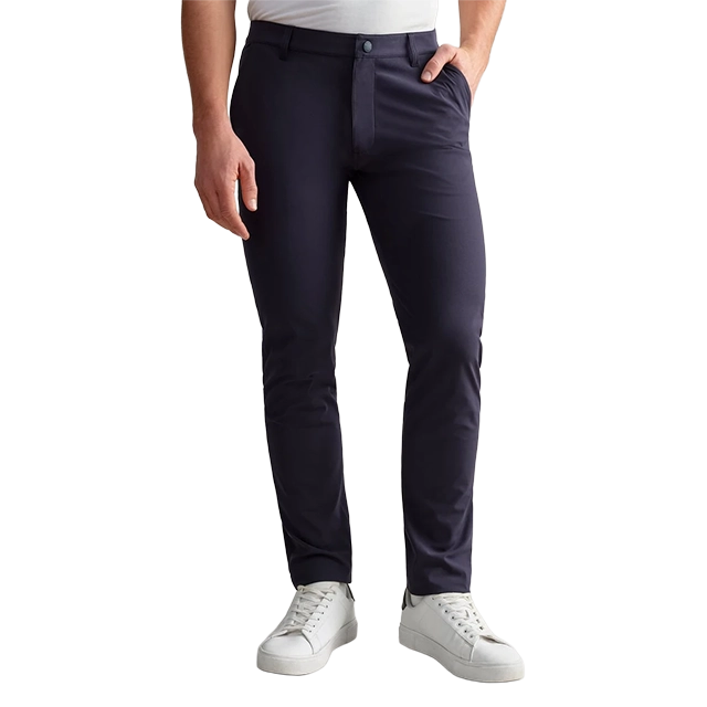 Man wearing navy blue pants and white sneakers.