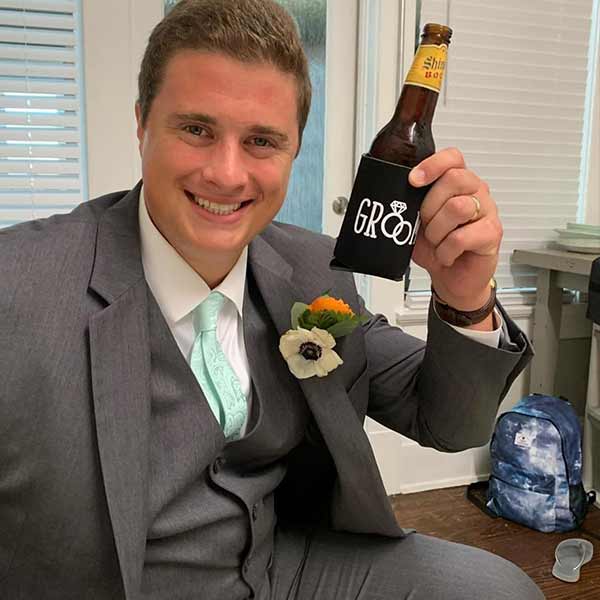 Groom wearing our clara paisley tie in seafoam.