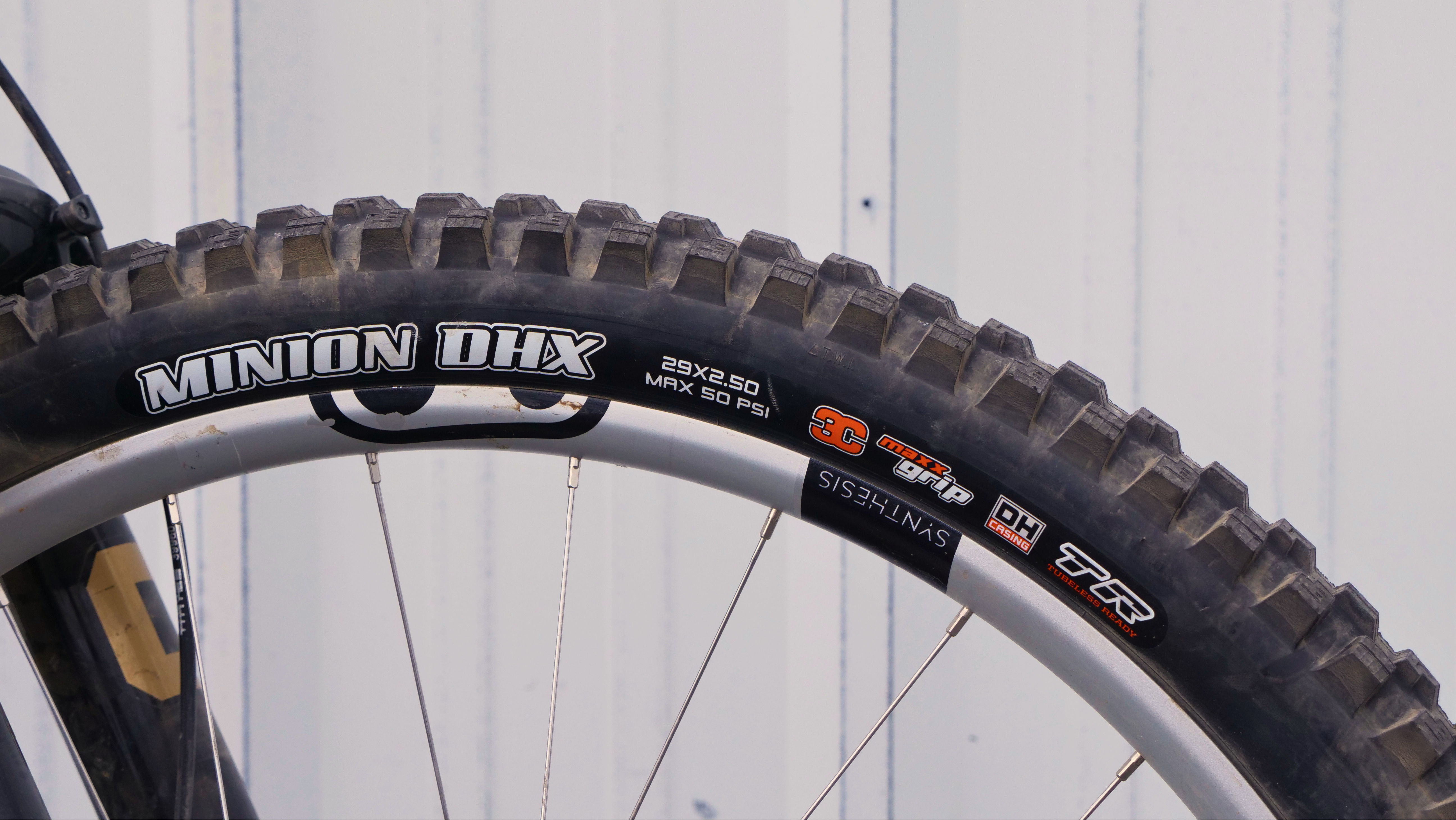 Close-up of a mountain bike tire with tread pattern.