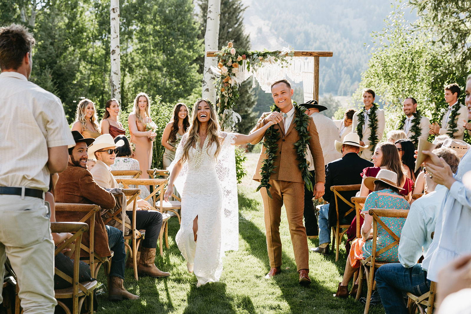 Bride and Groom walking down aisle in outdoor ceremony