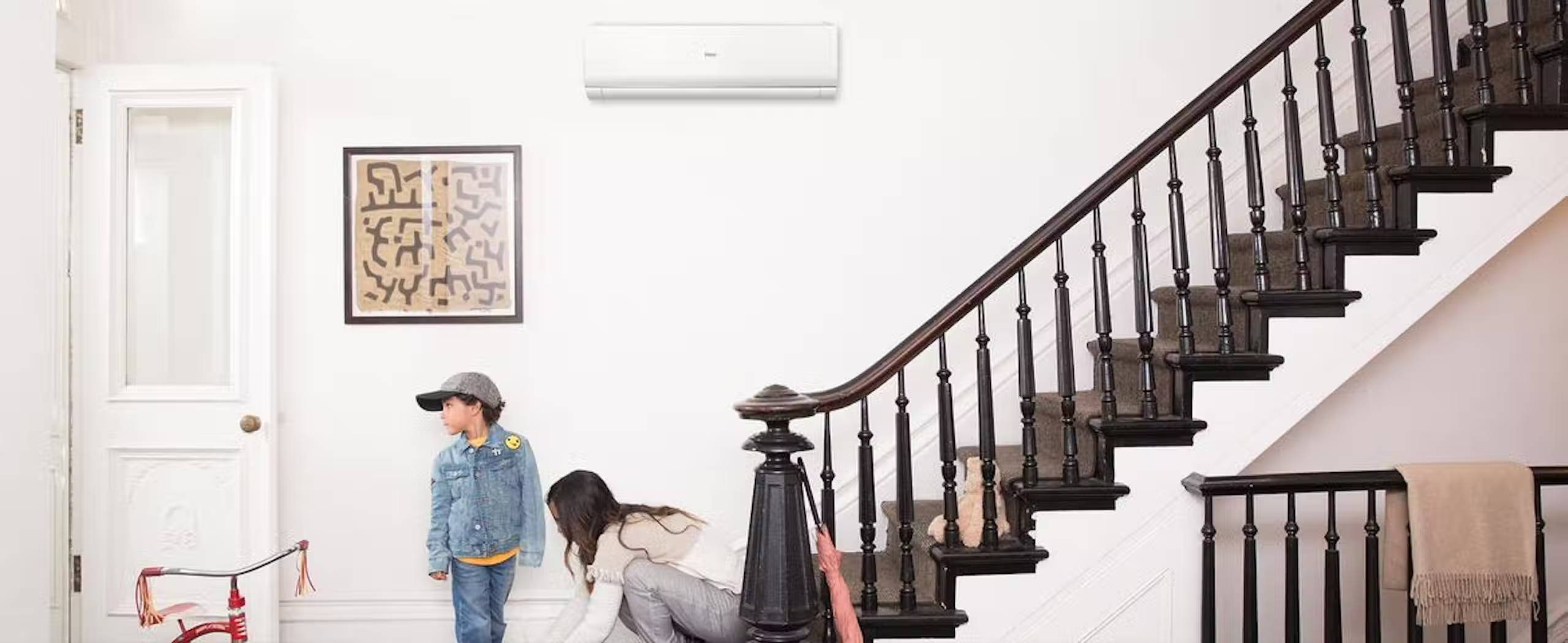 Photo of a Haier ductless wall mount mini split air conditioner installed in foyer of home.