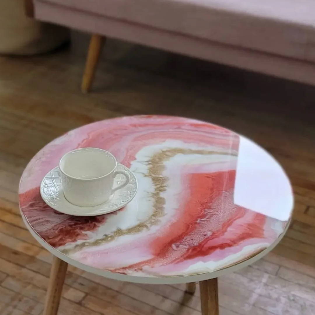 islaluna co epoxy table top resin coffee table in pink on a wood floor