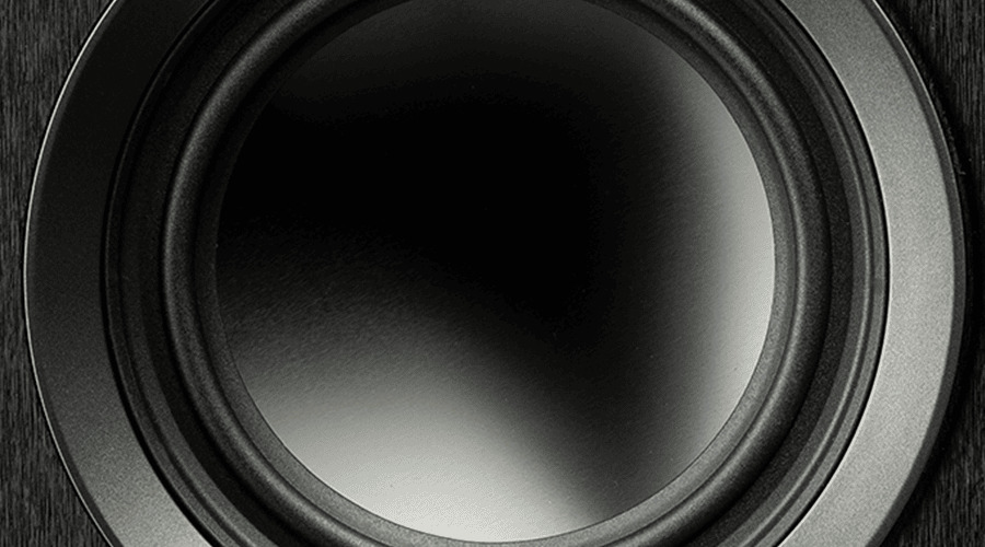 Close-up of a black speaker cone with a smooth surface.
