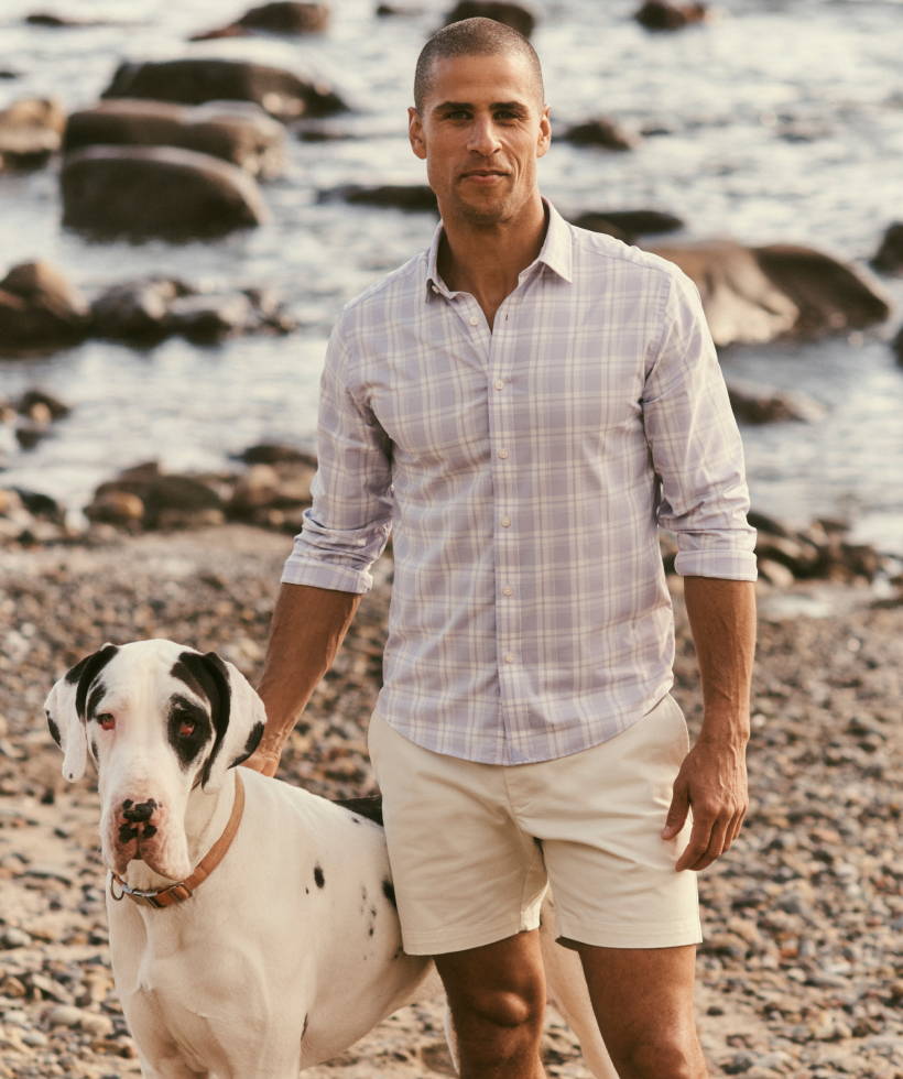 Model is wearing UNTUCKit Ferguson Button Down and St Vincent shorts in stone. 