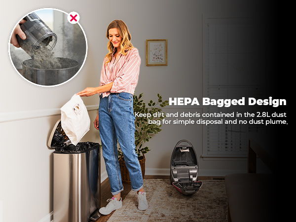 Woman using a vacuum with HEPA bagged design in a modern room.