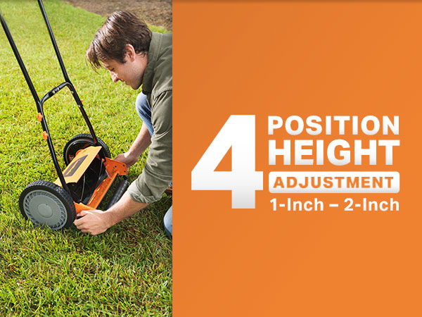 Person adjusting the height of a lawn mower on grass.