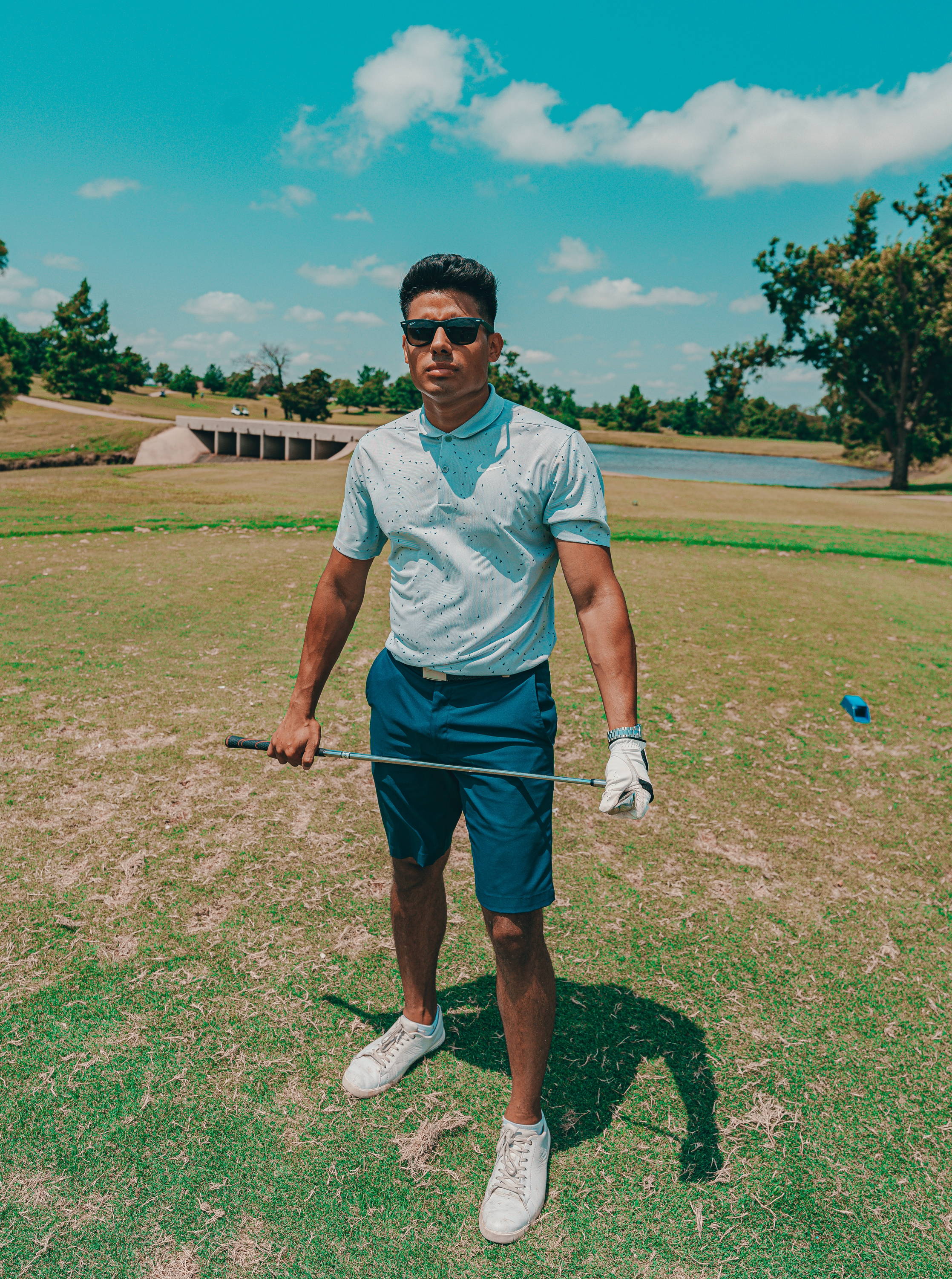 Man wearing golf sunglasses