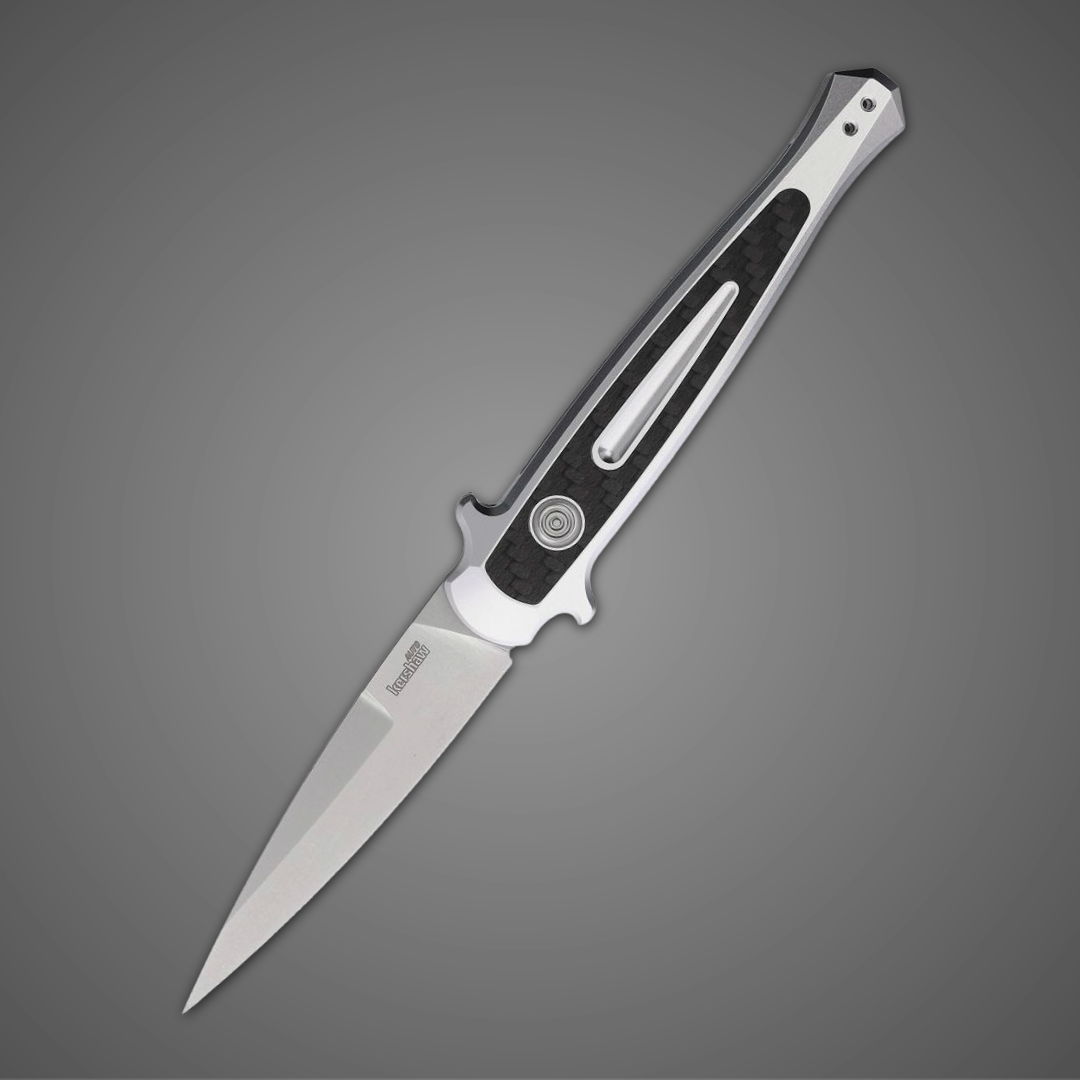 A silver and black folding knife on a gray background.