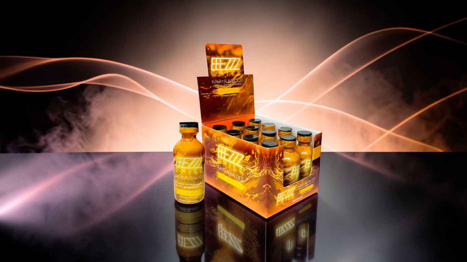 Bottles and display box of a beverage on a reflective surface.