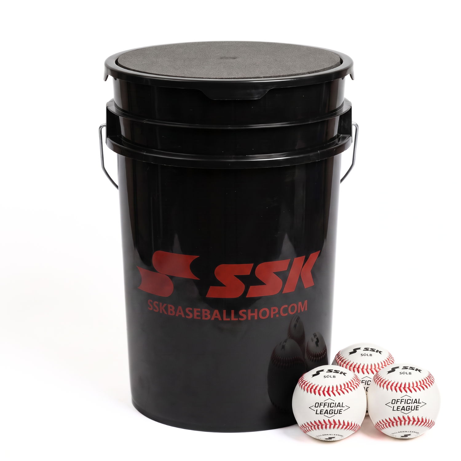 Black bucket with lid and three baseballs beside it.