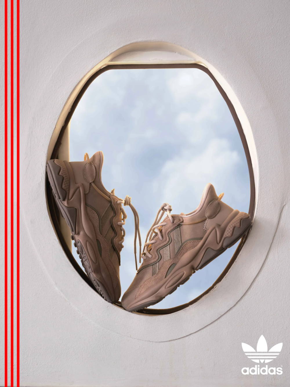 tan adidas shoes in airplane window