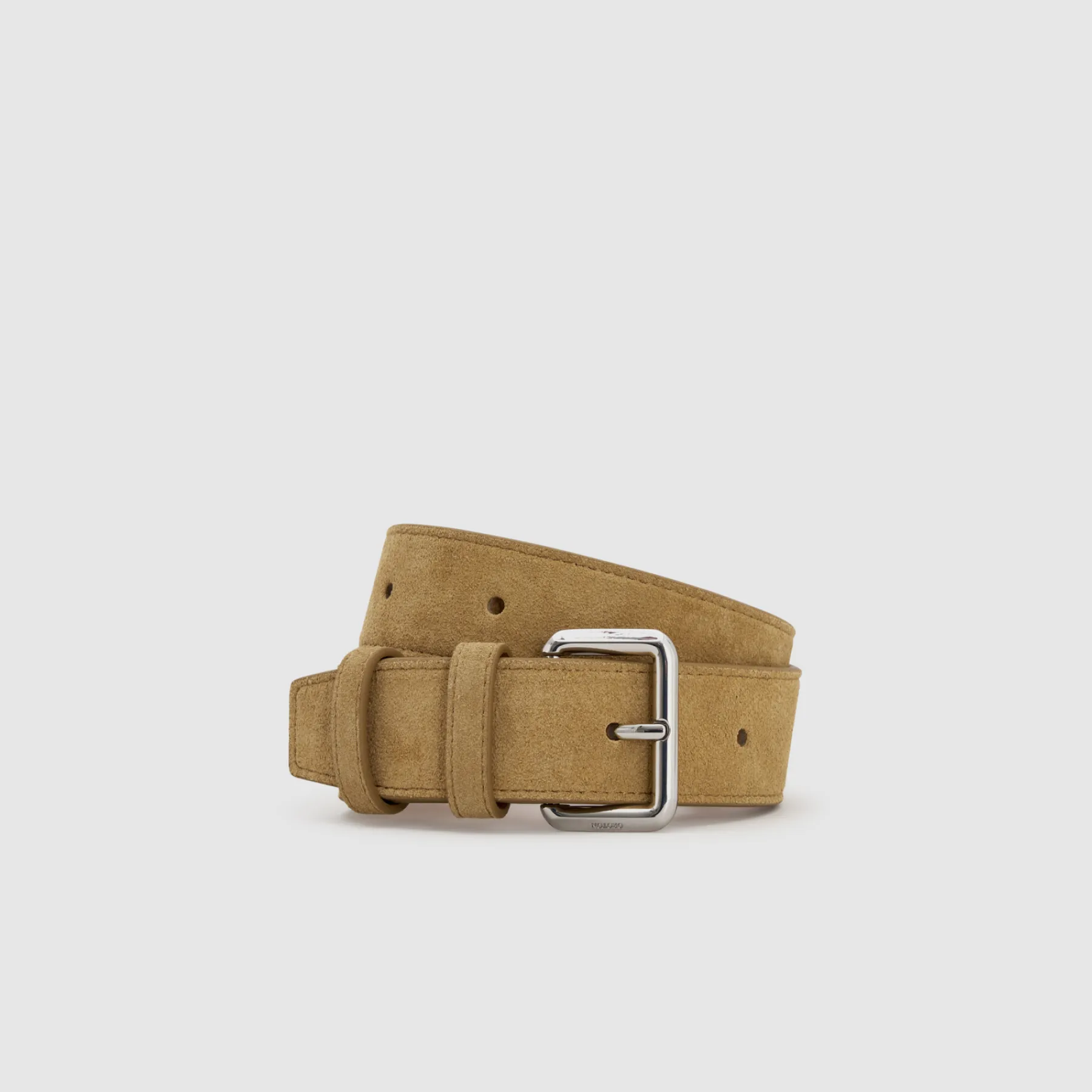 Tan suede belt with a silver buckle on a plain background.