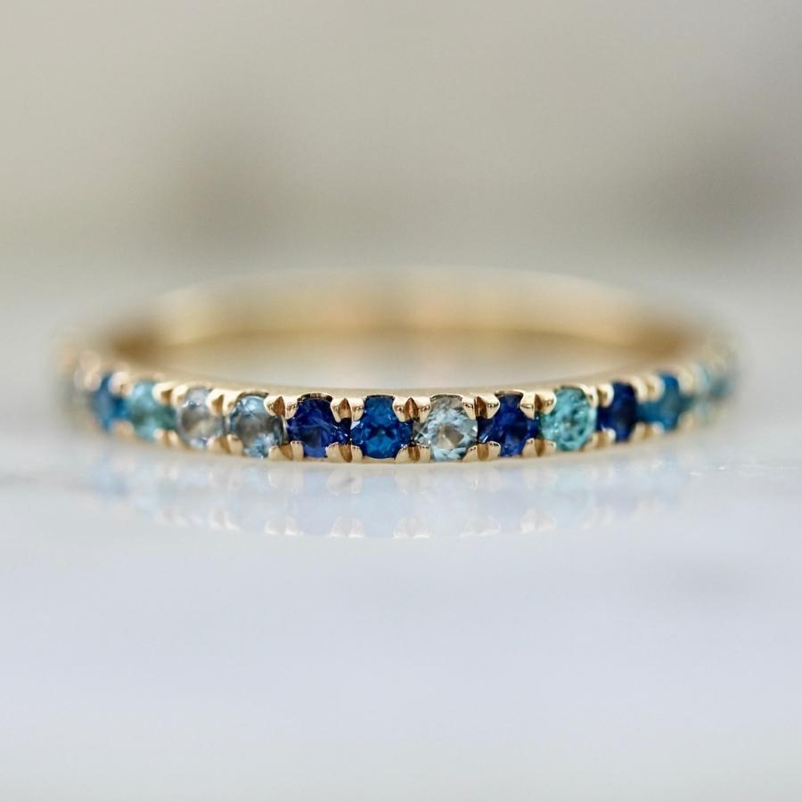 Zircon, topaz, sapphire, and aquamarine ring