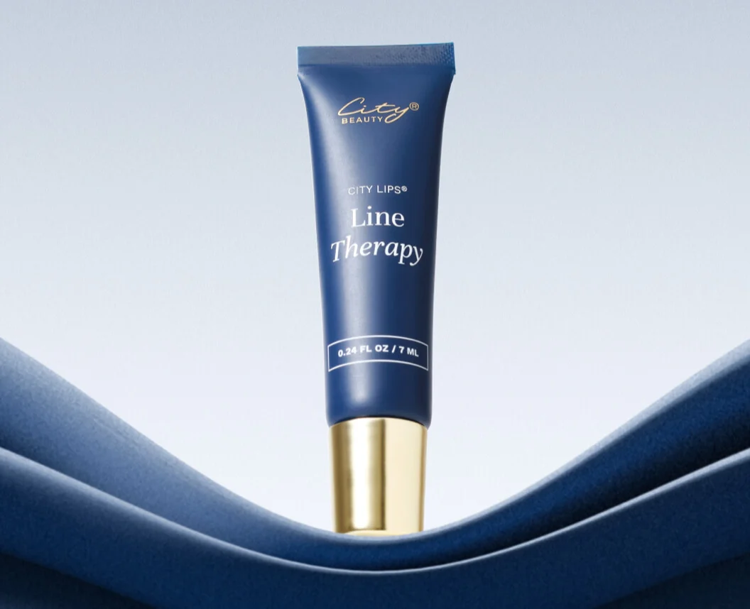 Blue tube of line therapy cream against a gradient background.