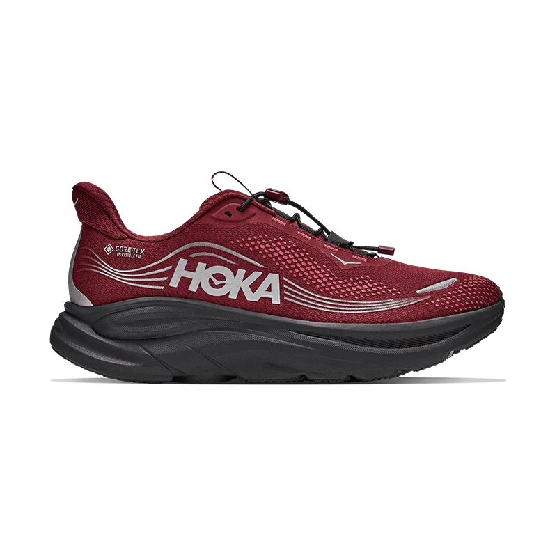 Red Hoka running shoe with black sole and laces.