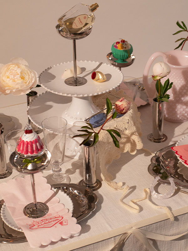 Decorative dessert display with elegant stands and assorted sweet treats.