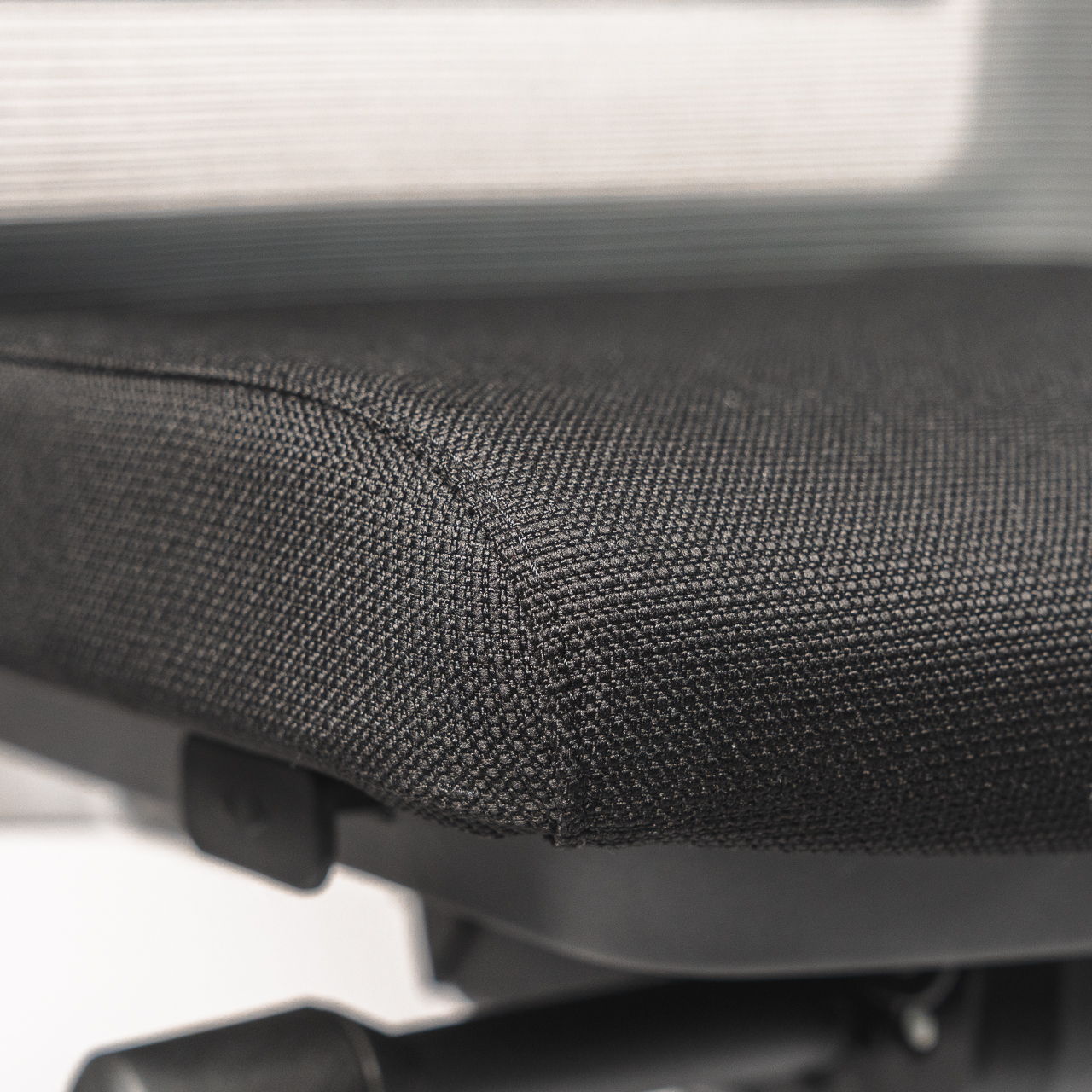 Close-up of the soft seat of the black, ergonomic " Active " office chair Active ofinto