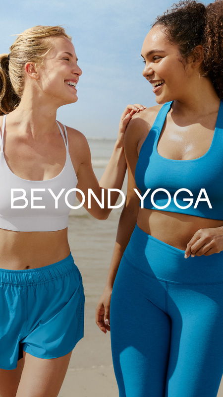 Two women smiling in athletic wear by the beach with text 