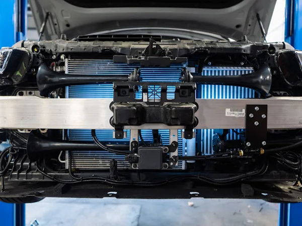 Bumper off train horn mounting radiator blue light shop lift Nicollette's 2022 Kia K5 Conductor's Special 232 customer install gallery photo 9