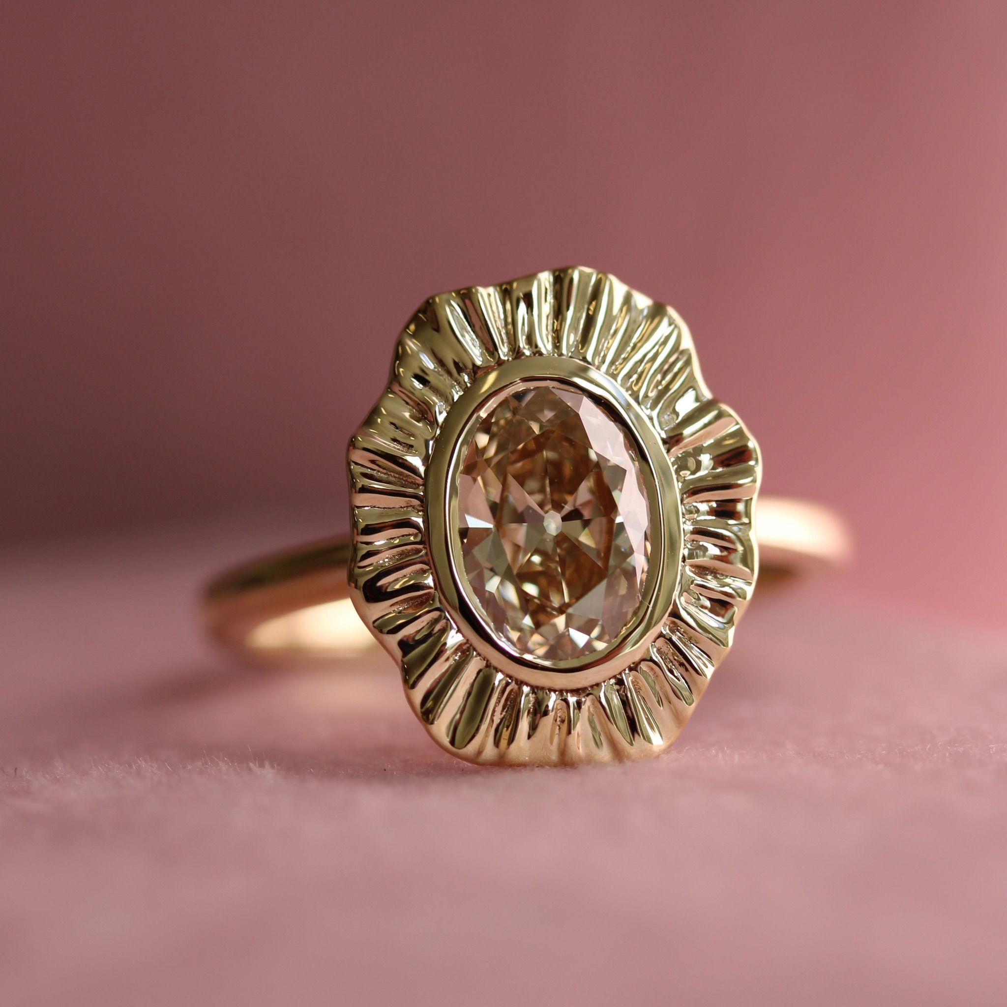 Oval cut champagne diamond ring in yellow gold Plissé setting by Cat Cason Fine