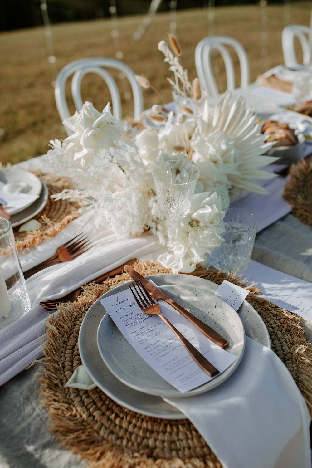Boho style dining set up with white flowers