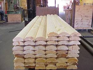 Northern White Cedar half log siding stacked up in Grand Rapids, MI warehouse