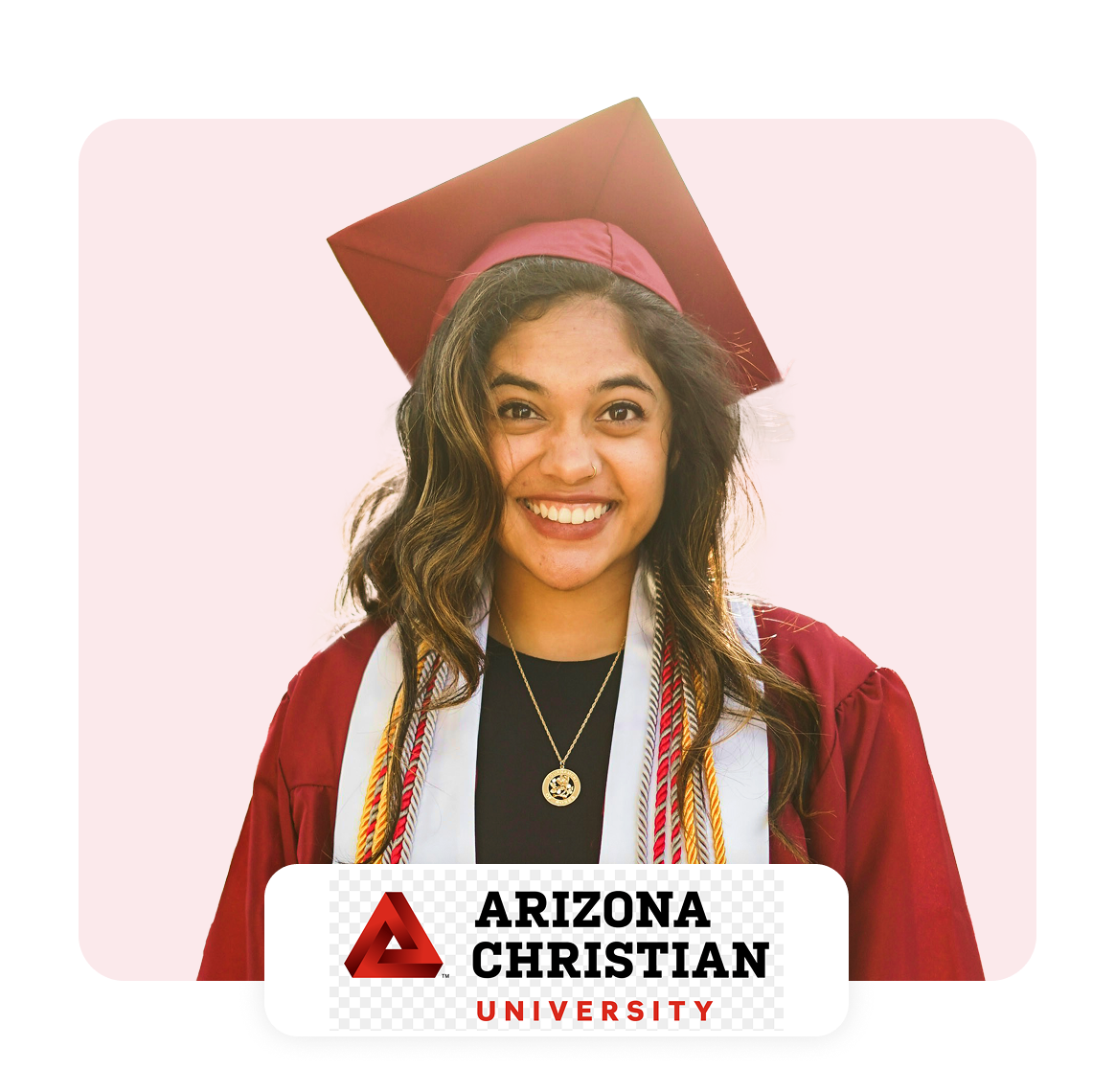 Smiling graduate in cap and gown from Arizona Christian University.