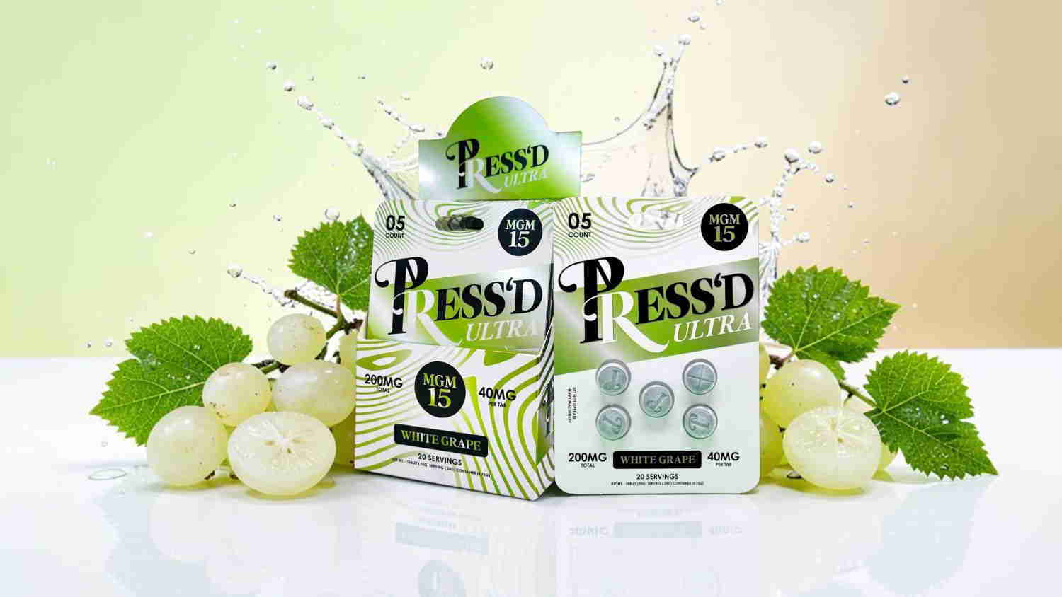 Two boxes of Pressed tablets surrounded by grapes and green leaves.