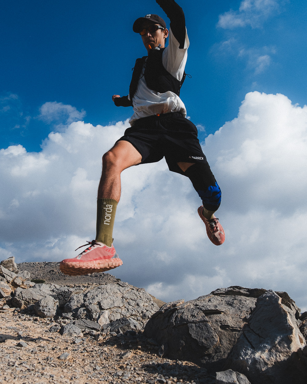 Runner testing the norda 001A on technical terrain in Jebel Jais