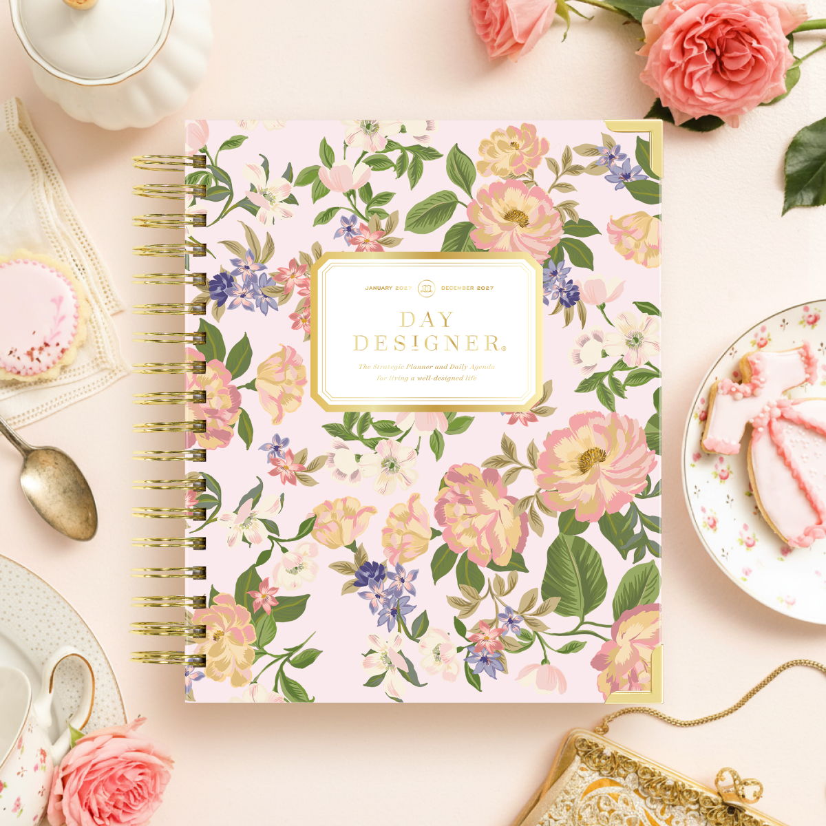 2027 day designer planner featuring flowers on a blush pink background