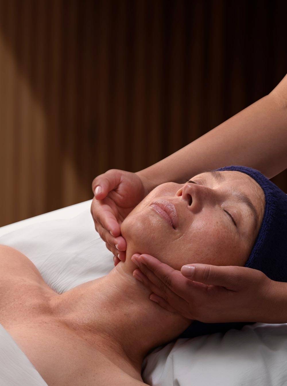 Woman receiving oncology relief ritual