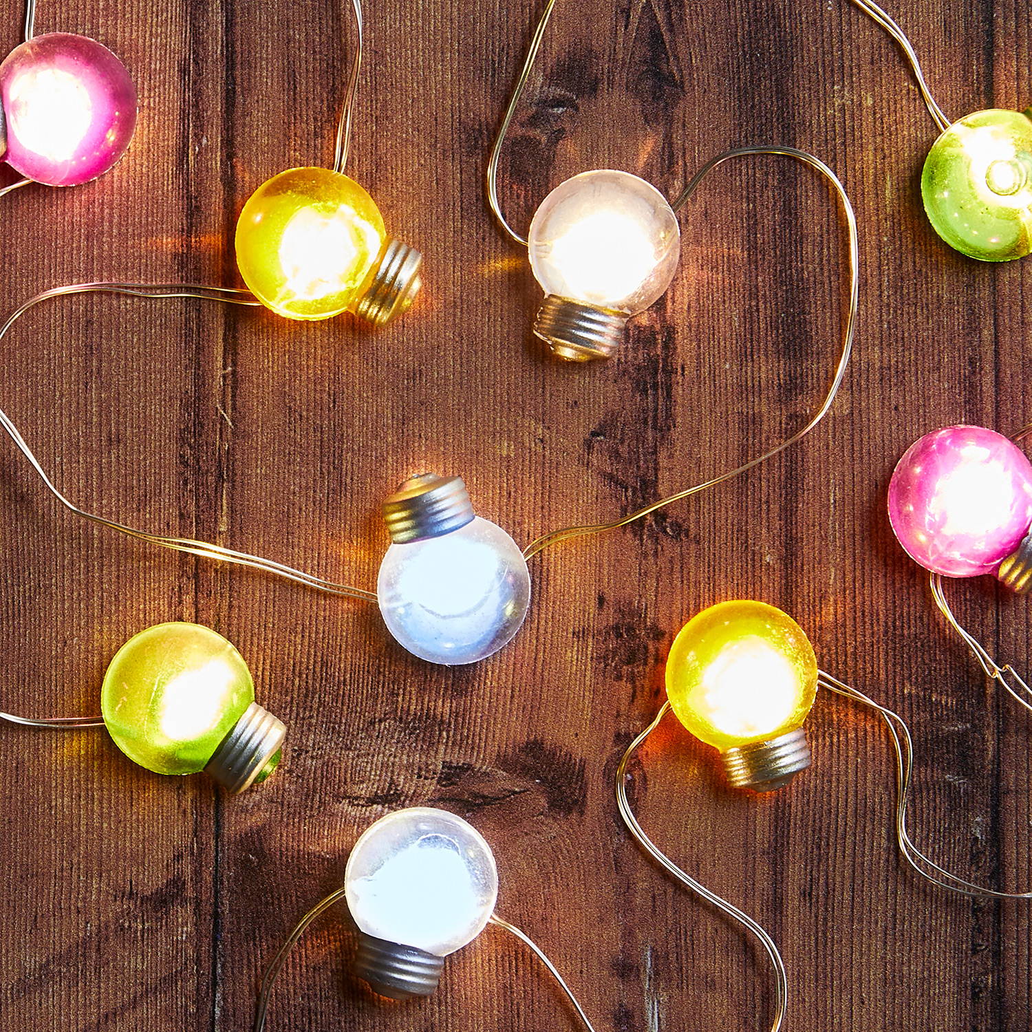 Multi coloured micro festoons illuminated on table