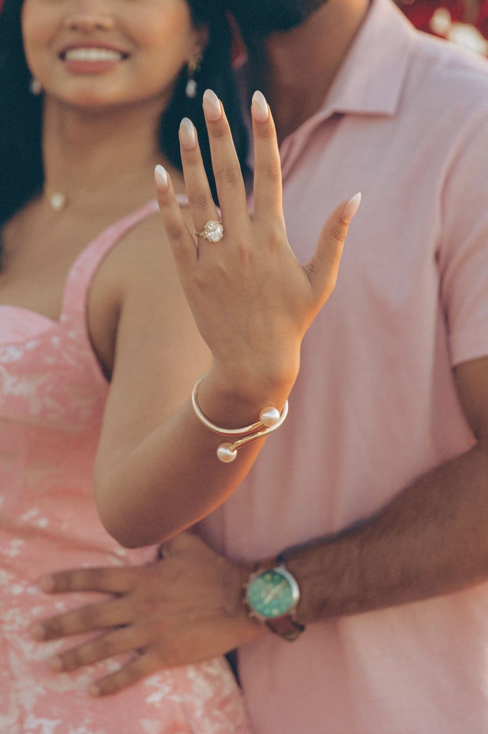 engaged couple showing off ring