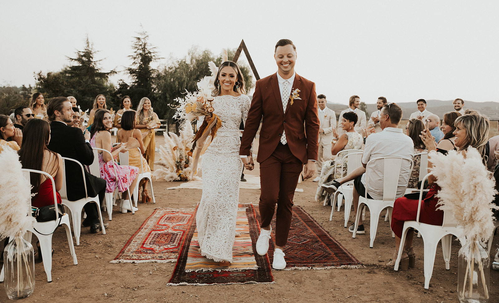 Grace Loves Lace bride wearing the Orla Gown with new husband 