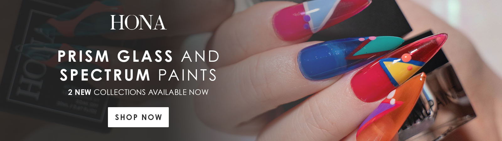 Colorful nail art with vibrant paint and a promotional banner.