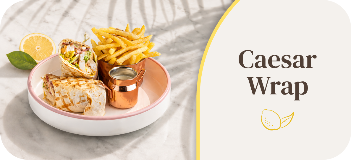 Caesar wrap with fries and dipping sauce on a plate.
