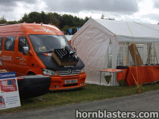 Exterior three-quarter view of Reza's 2003 Mercedes-Benz Sprinter with HornBlasters Conductor's Special 232 train horn kit featured customer install gallery photo 1