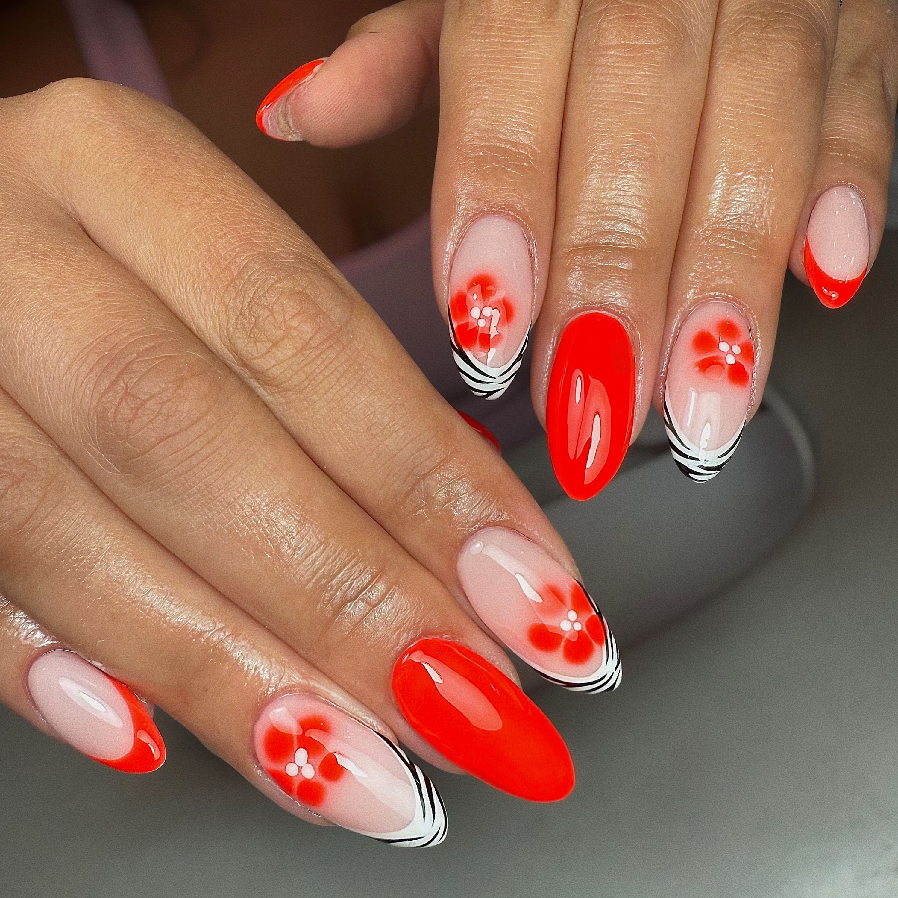 Red floral and zebra print nails
