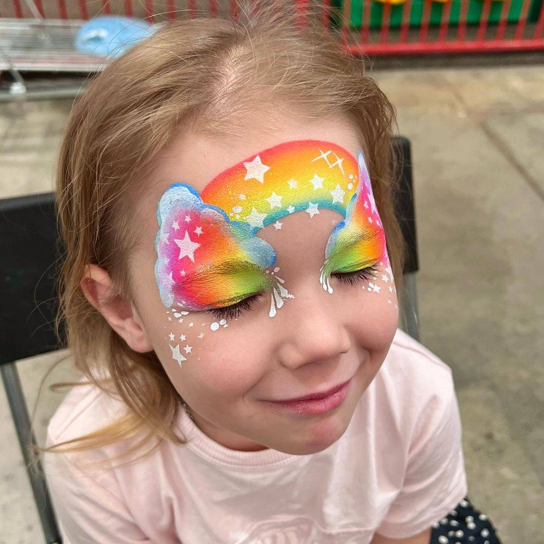 rainbow and stars face paint girl