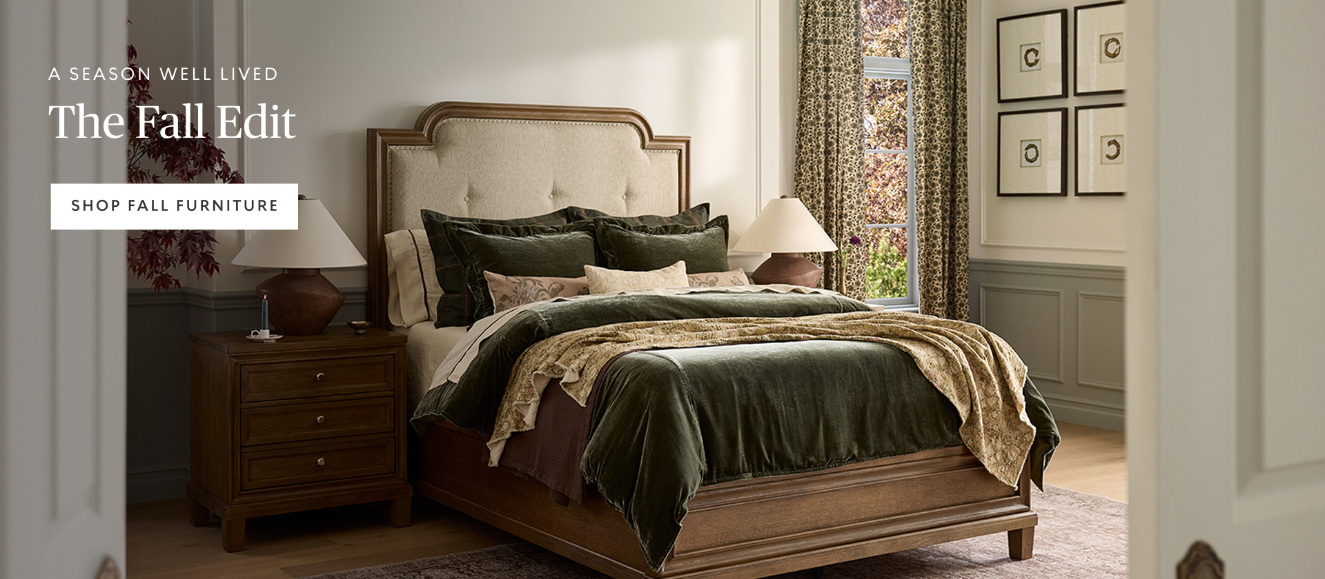 Hero banner featuring a rustic wood bed with layered green and neutral bedding in a bright bedroom. Promotional headline for The Fall Edit collection.