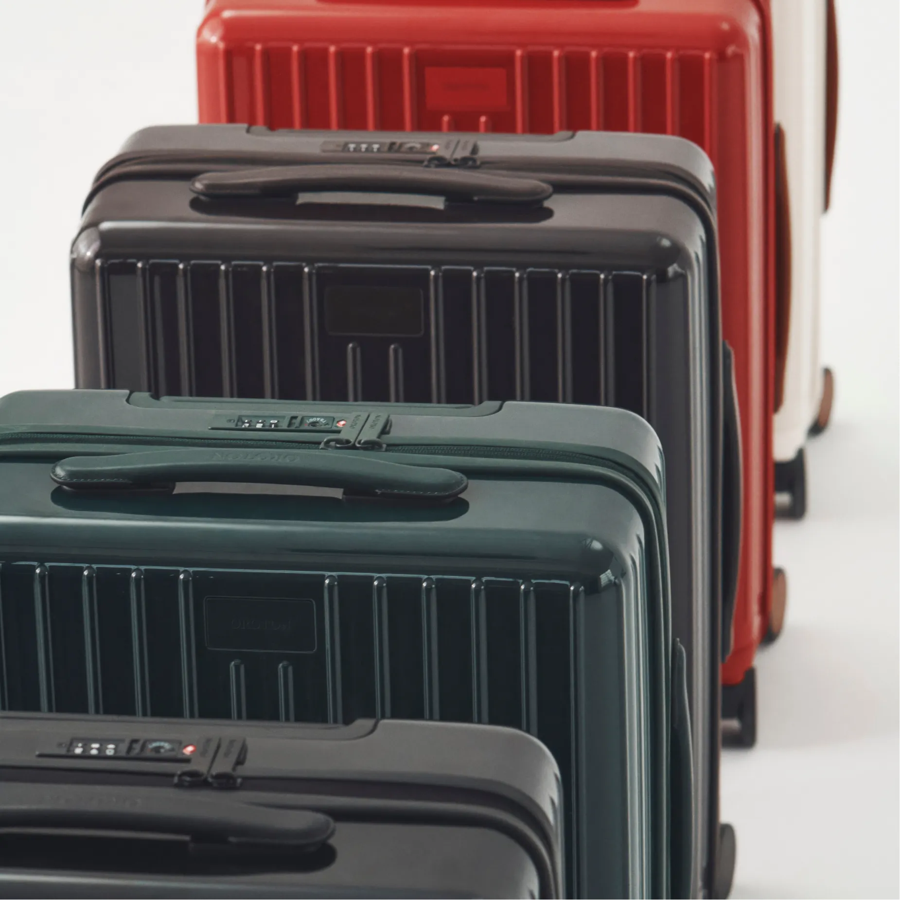 A row of colorful suitcases in various sizes and colors.