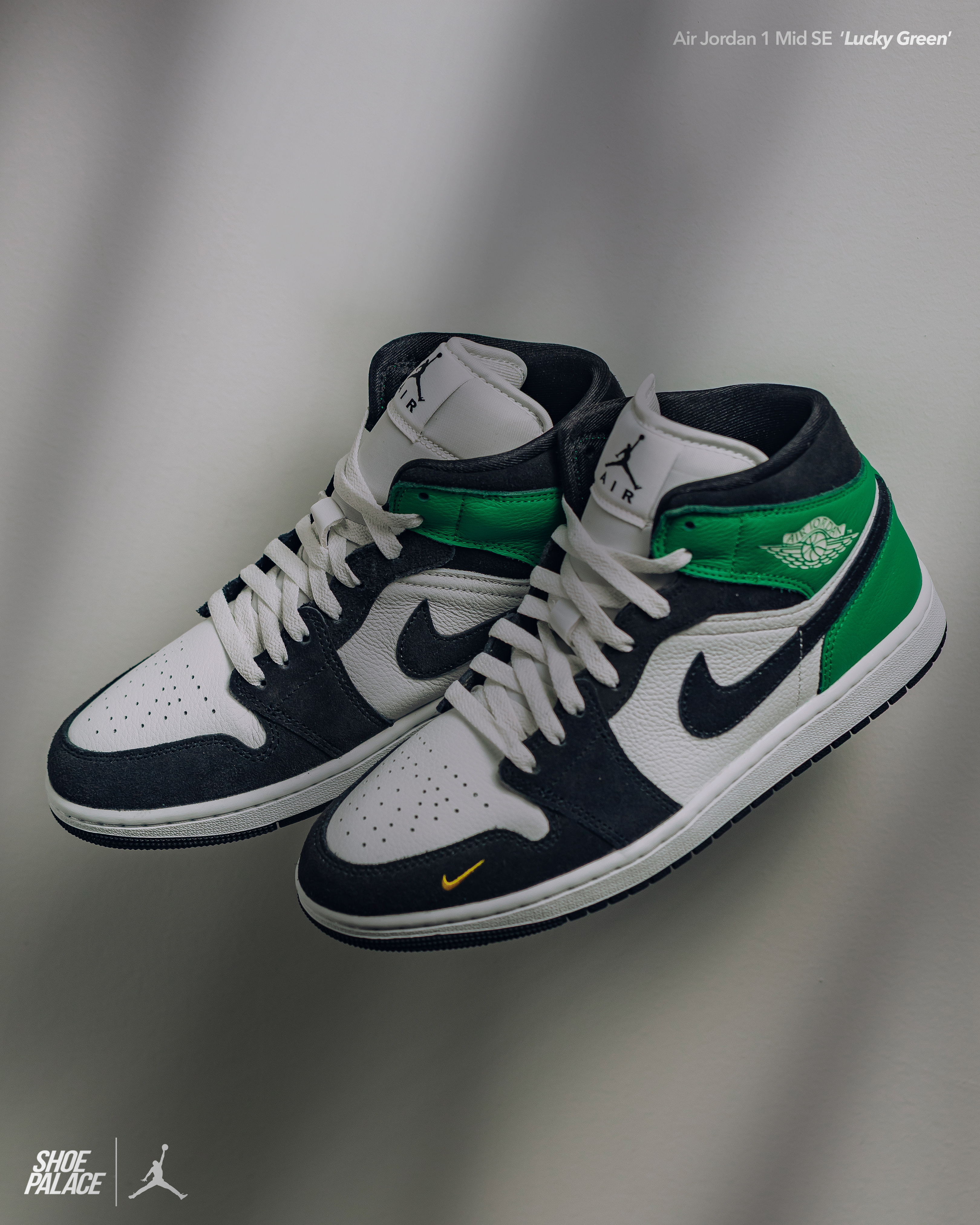 A pair of stylish Nike Air Jordan sneakers in navy and green.
